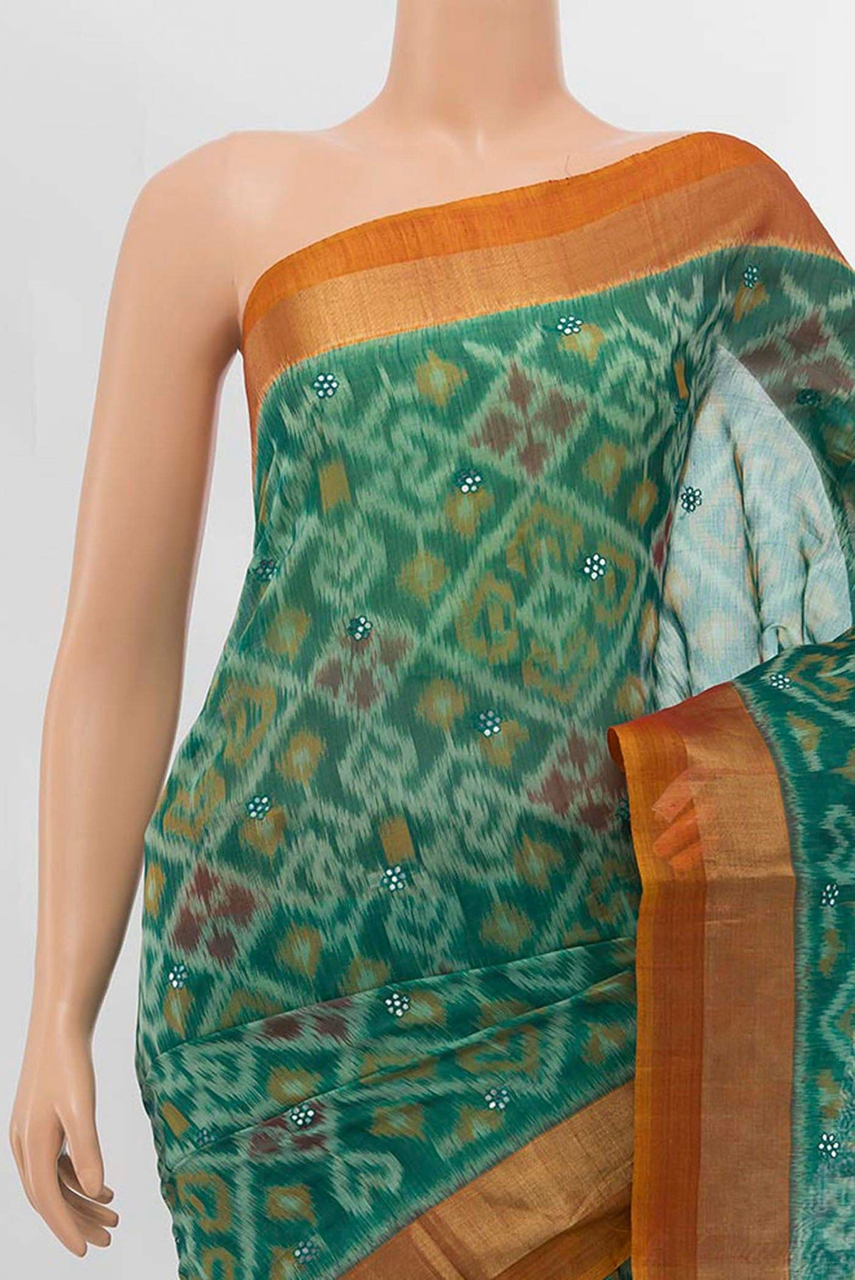 Border image of Green Silk Cotton Saree with Ikat design on the body and Zari Border