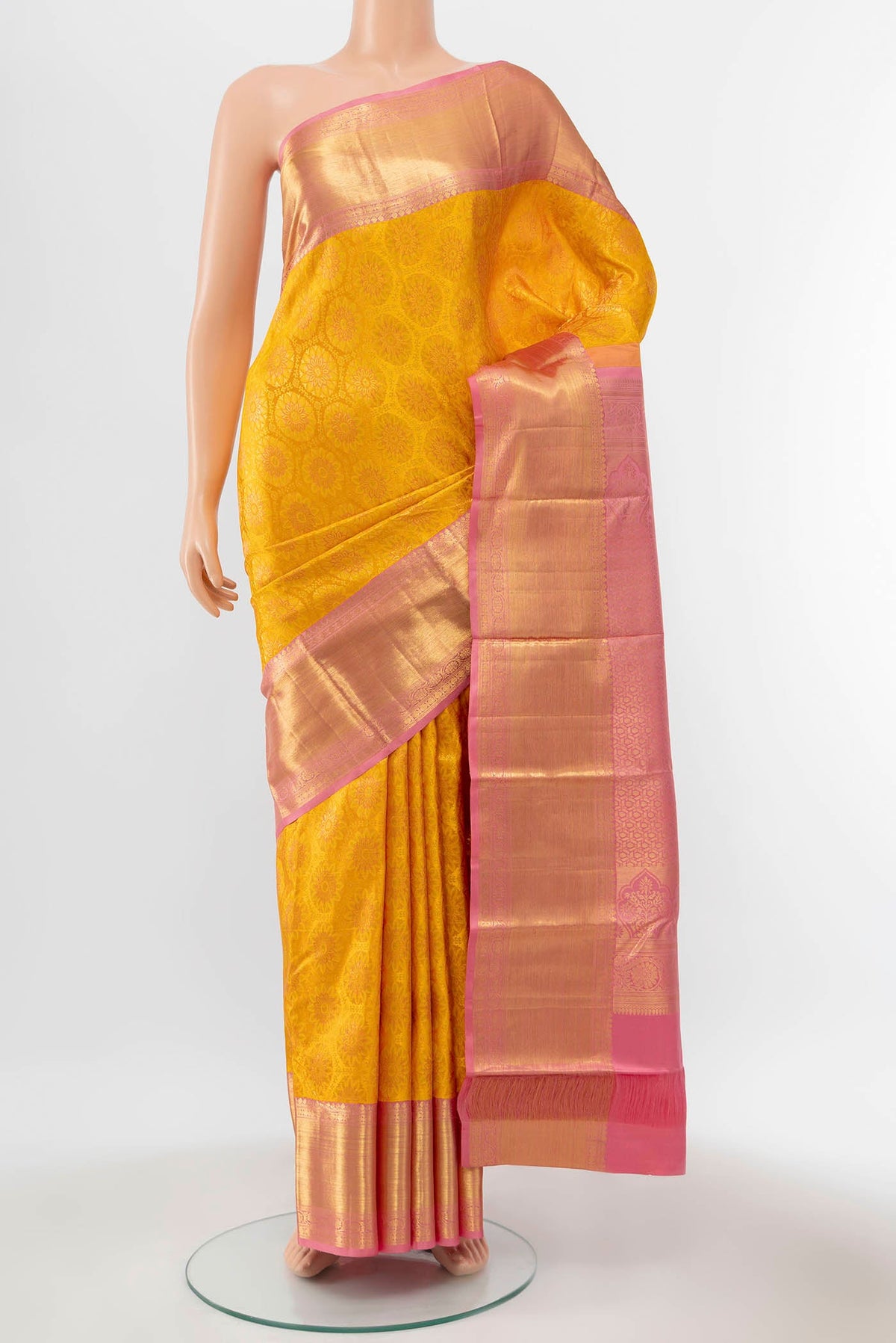 Yellow Kanchipuram Silk Saree with Zari Brocade on the body and Zari Border displayed on a mannequin
