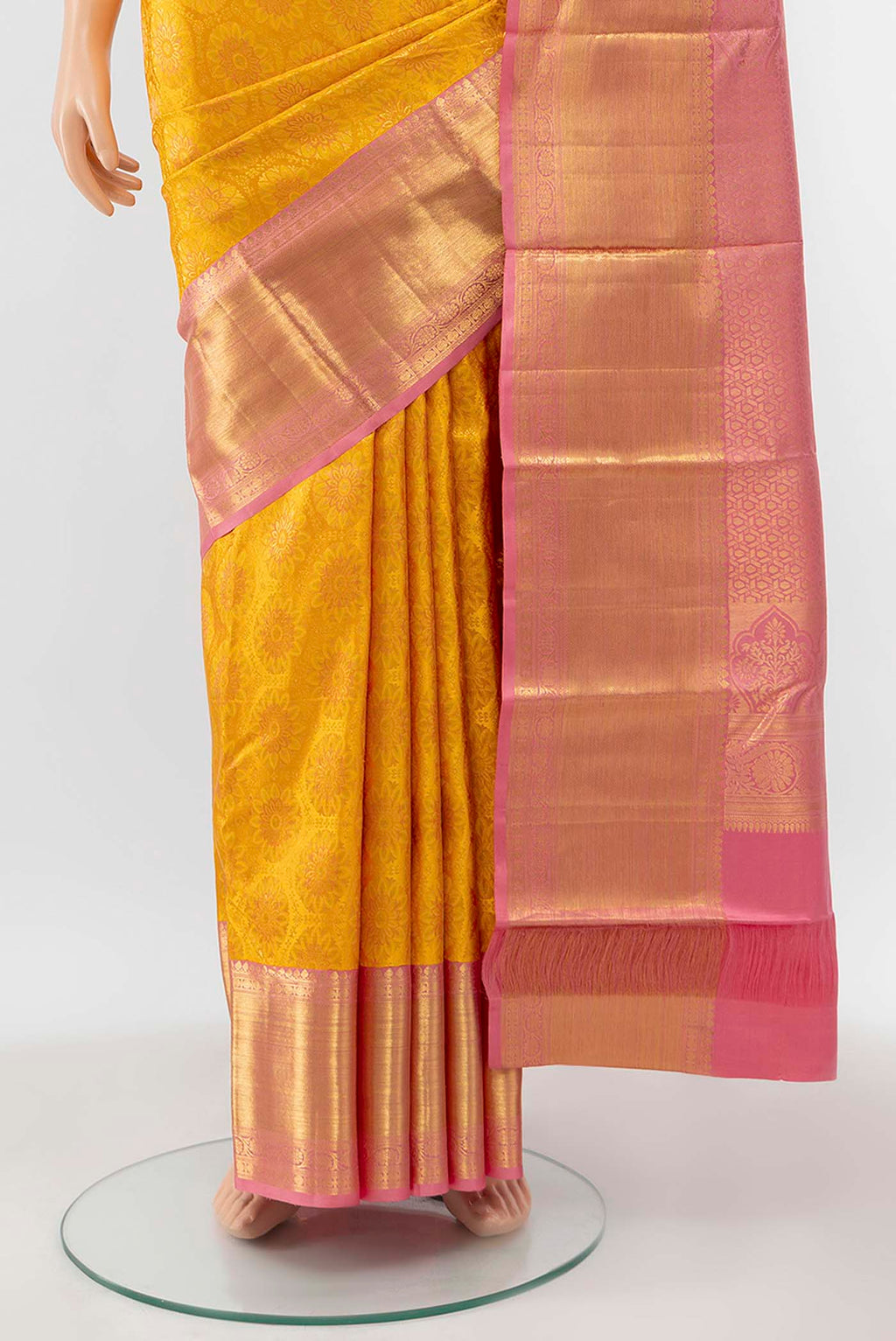 Pleats and pallu of Yellow Kanchipuram Silk Saree with Zari Brocade on the body and Zari Border