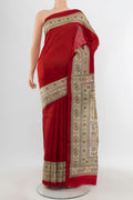 Red Tussar Silk Saree with Floral Print on the body and Printed Border.  displayed on a mannequin
