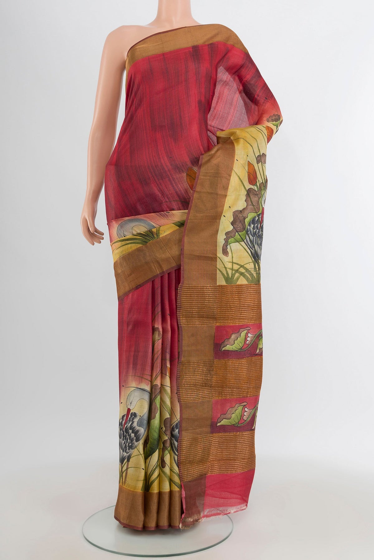 Maroon Tussar Silk Saree with Floral Print on the body and Zari Border.  displayed on a mannequin