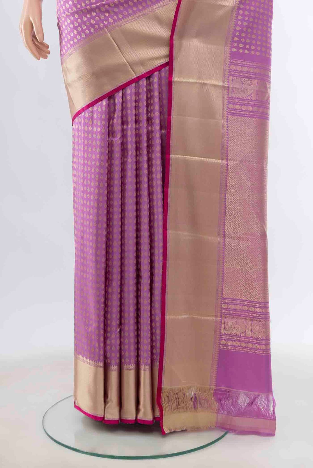 Pleats and pallu of Lavender Kanchipuram Silk Saree with Zari Butta on the body and Silk Border