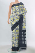 Off White Pochampally Silk Saree with Ikat Print on the body and Silk Border displayed on a mannequin