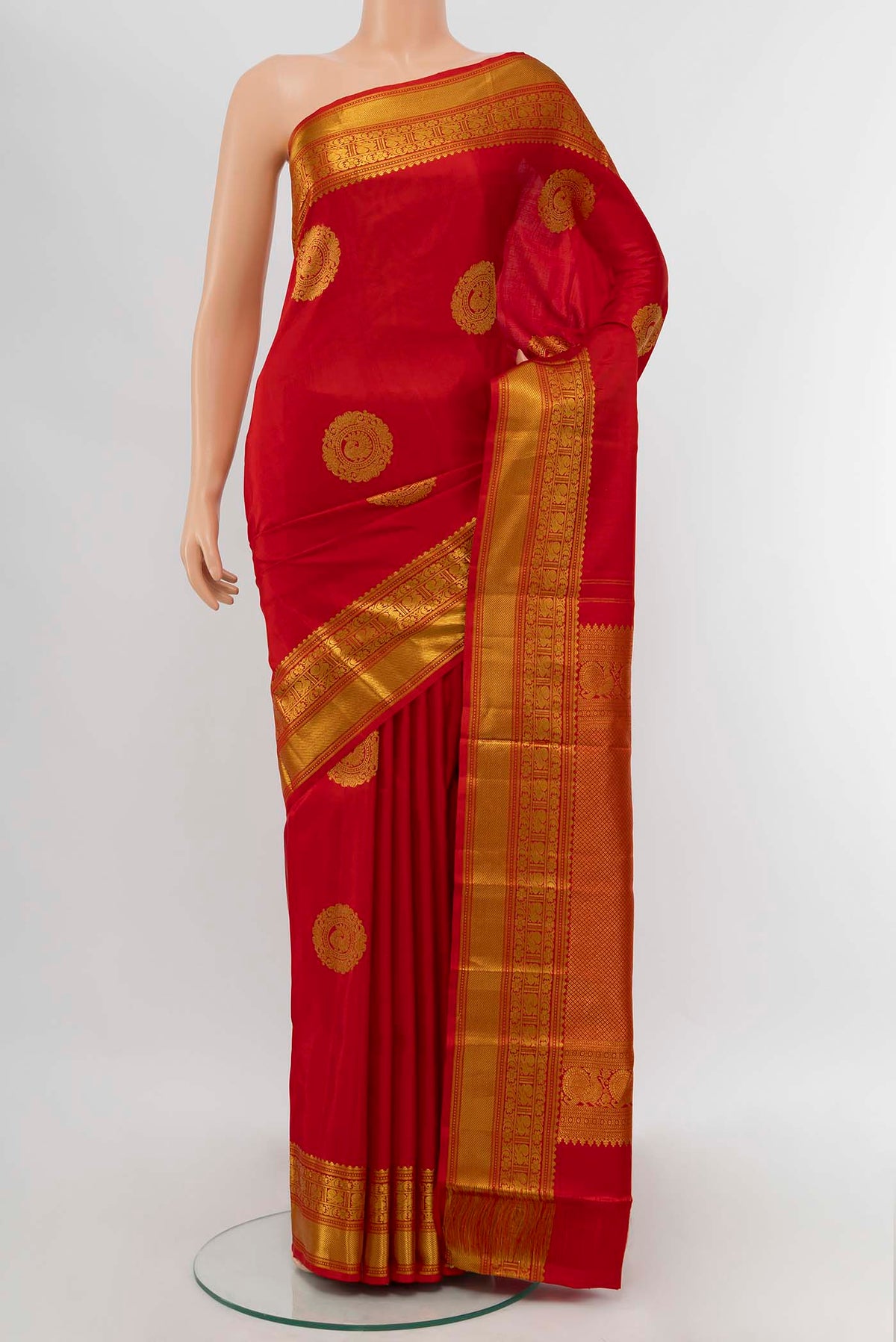 Red Kanchipuram Silk Saree with Zari Butta on the body and Zari Border displayed on a mannequin