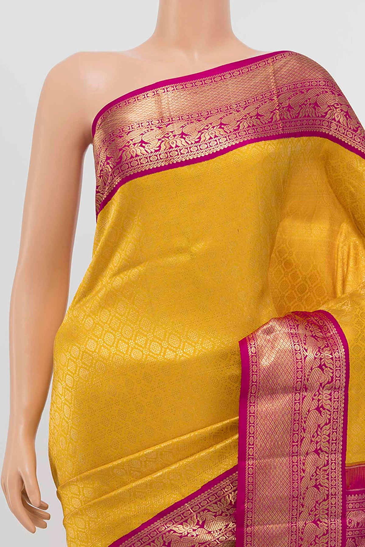 Border image of Yellow Kanchipuram Silk Saree with Zari Brocade on the body and Silk Border