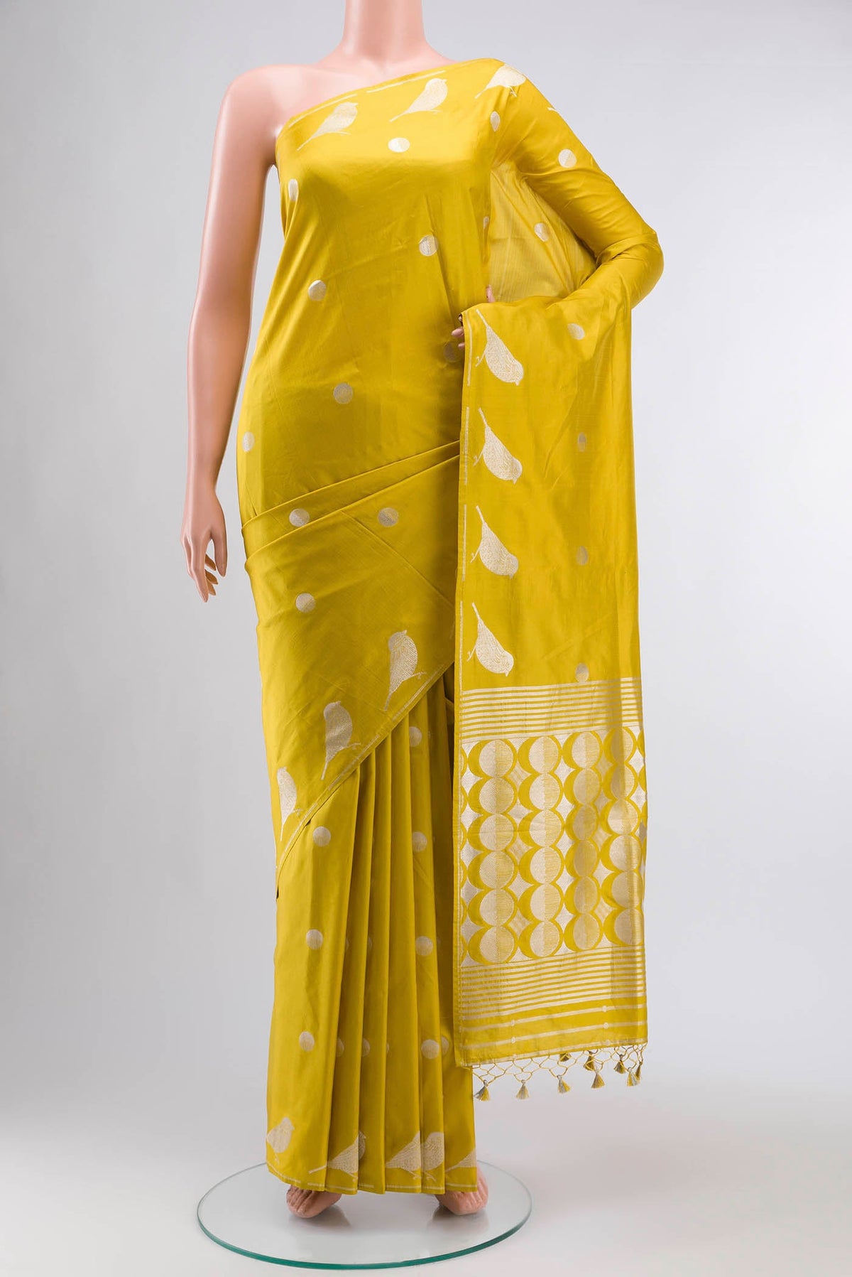 Yellow Banarasi Silk Saree with Zari Butta on the body and Zari Border displayed on a mannequin