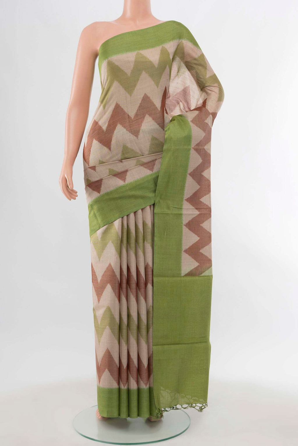 Pista Green Tussar Silk Saree with Zari Brocade on the body and Silk Border displayed on a mannequin