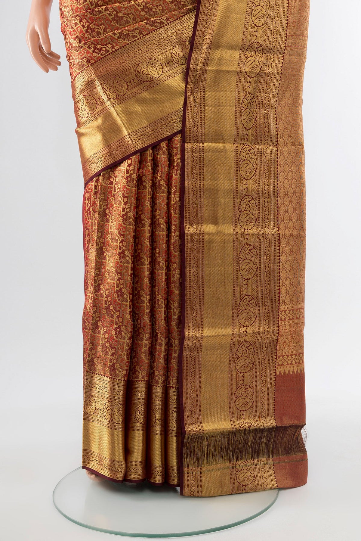 Pleats and pallu of Golden Kanchipuram Silk Saree with Zari Butta on the body and Silk Border. 