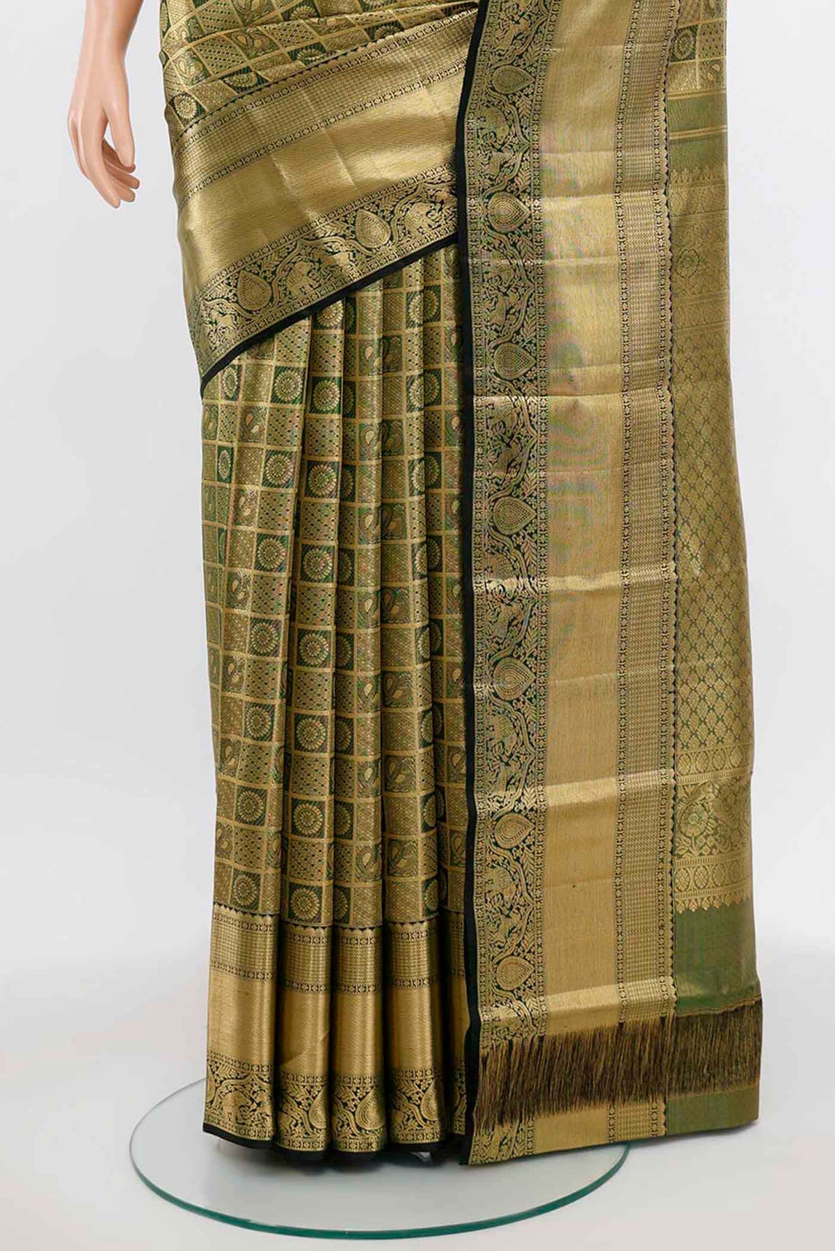 Pleats and pallu of Golden Kanchipuram Silk Saree with Zari Butta on the body and Silk Border. 