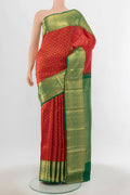 Red Kanchipuram Silk Saree with Zari Butta on the body and Silk Border.  displayed on a mannequin