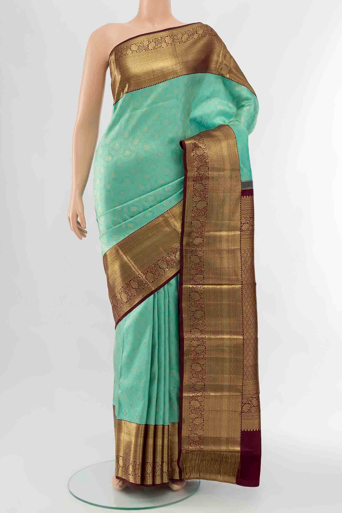 Light Blue Kanchipuram Silk Saree with Zari Brocade on the body and Zari Border displayed on a mannequin