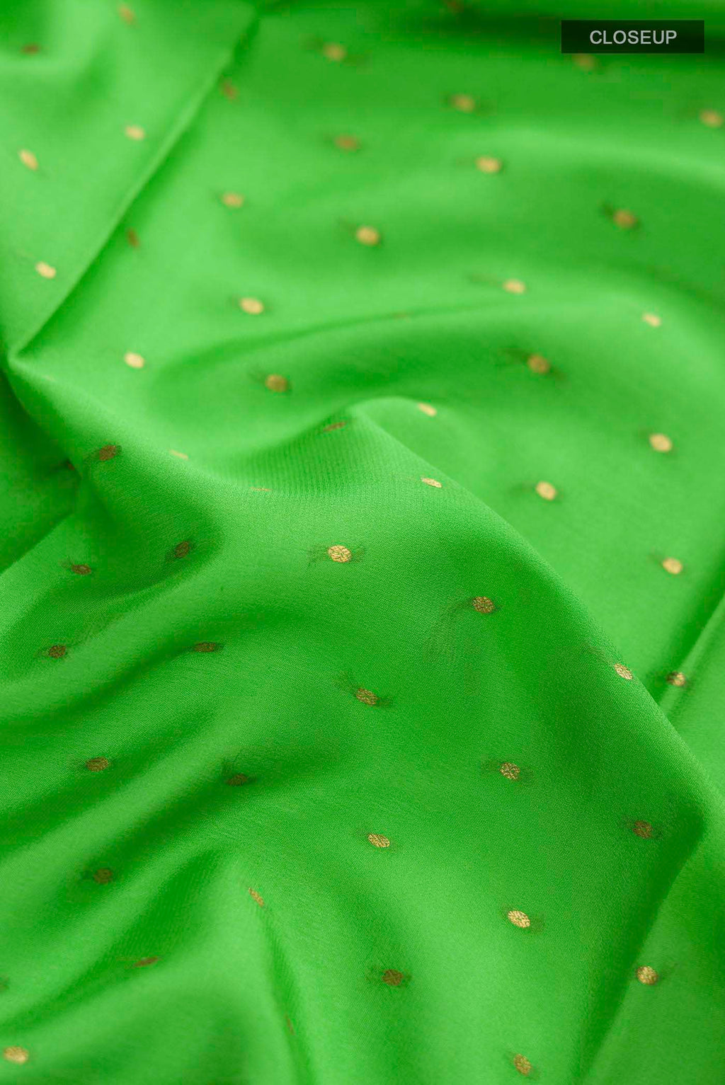 Close up of Green Mysore Crepe Saree with Zari Butta on the body and Zari Border displaying folds