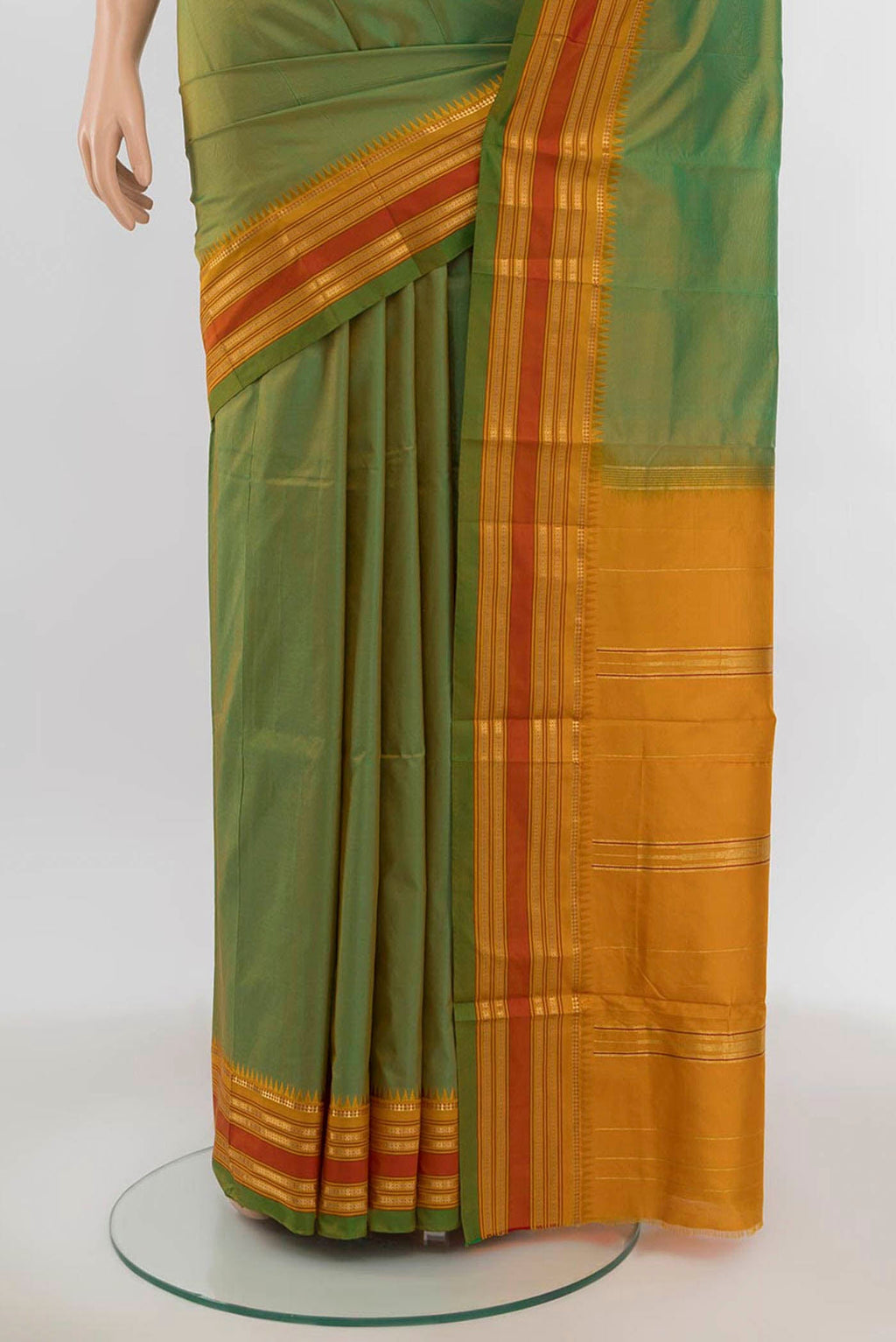 Pleats and pallu of Parrot Green Narayanpet Silk Saree with Zari Butta on the body and Silk Border. 