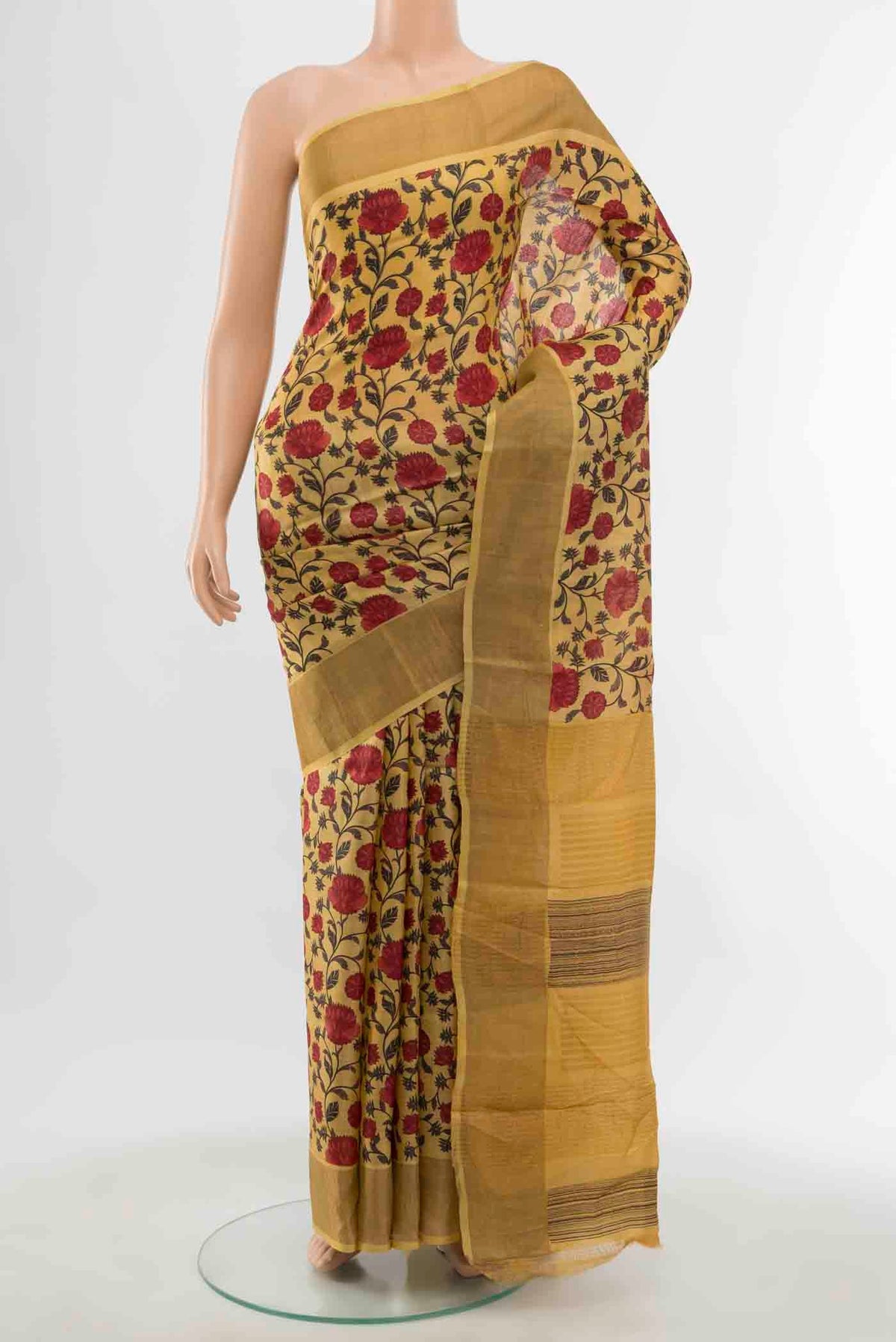 Mustard Tussar Saree with Floral Print on the body and Silk Border displayed on a mannequin
