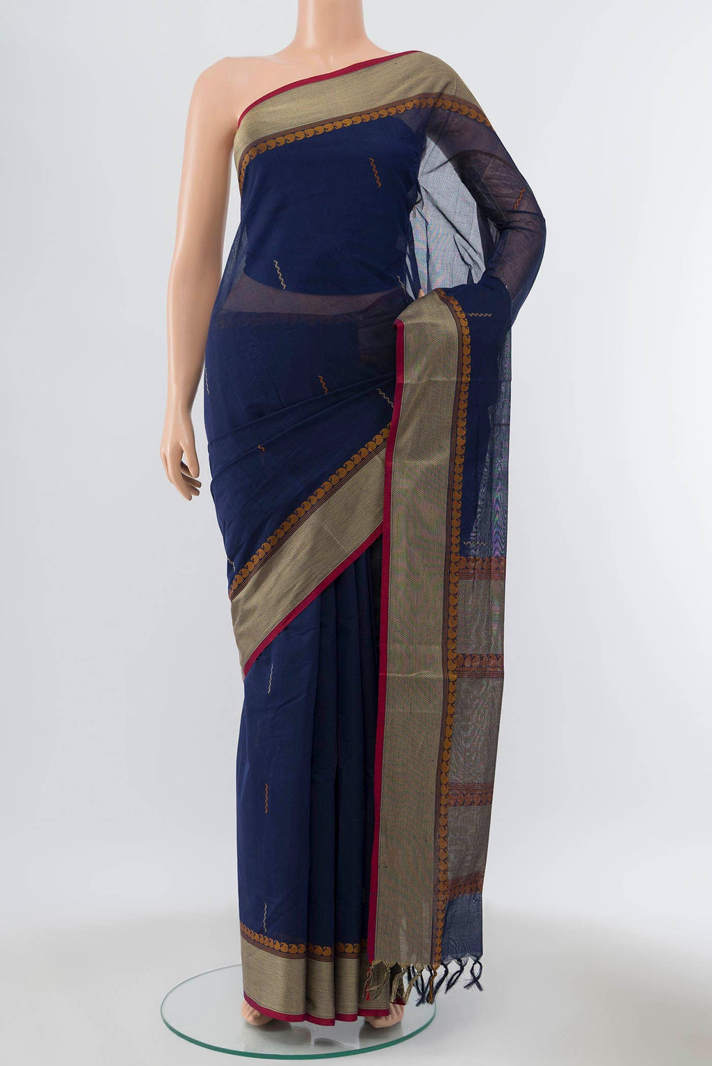 Navy Blue Coimbatore Cotton Saree with Ikat Print on the body and Thread Embroidery Border displayed on a mannequin