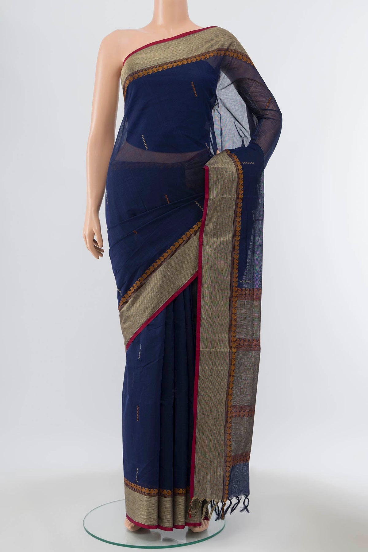 Navy Blue Coimbatore Cotton Saree with Ikat Print on the body and Thread Embroidery Border displayed on a mannequin