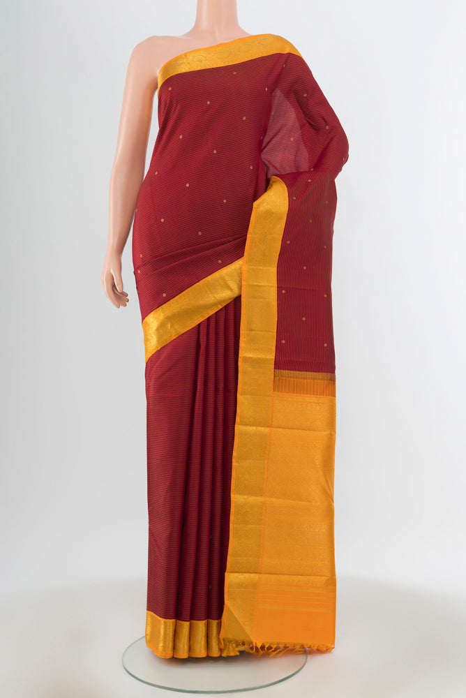 Pure Silk Pure Zari Red Kanchipuram Saree with Zari Butta on the body and Zari Border.  displayed on a mannequin