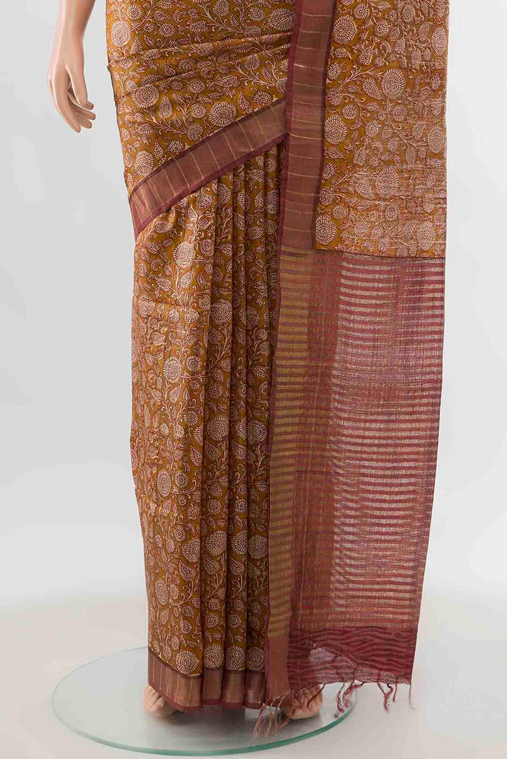 Pleats and pallu of Mustard Tussar Silk Saree with Floral Print on the body and Zari Border