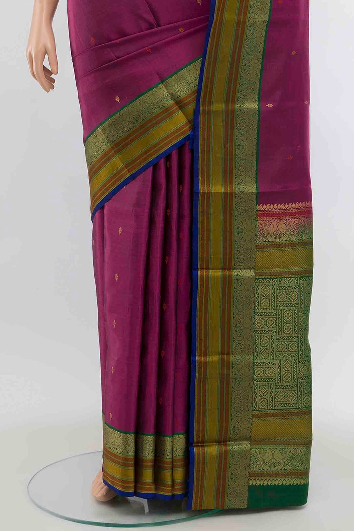 Pleats and pallu of Magenta Soft Silk Saree with Zari Butta on the body and Silk Border