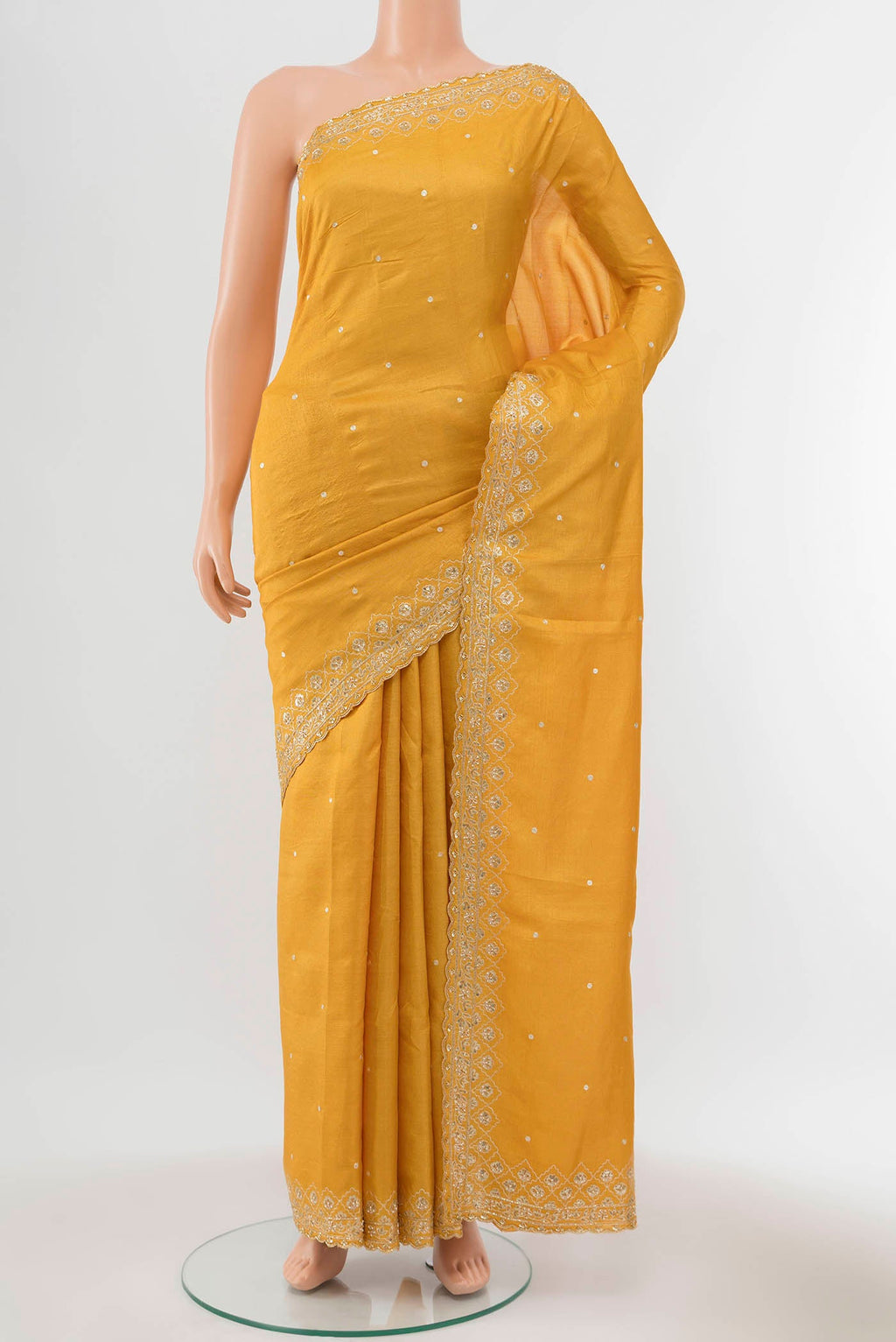 Yellow Tussar Silk Saree with Zari Butta on the body and Silk Border displayed on a mannequin