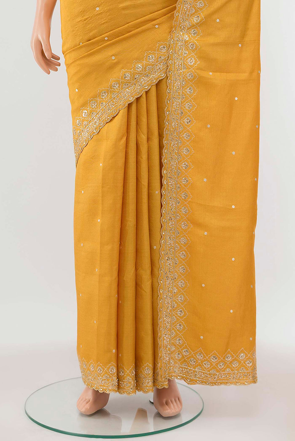 Pleats and pallu of Yellow Tussar Silk Saree with Zari Butta on the body and Silk Border