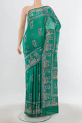 Light Blue Tussar Saree with Floral Print on the body and Silk Border.  displayed on a mannequin