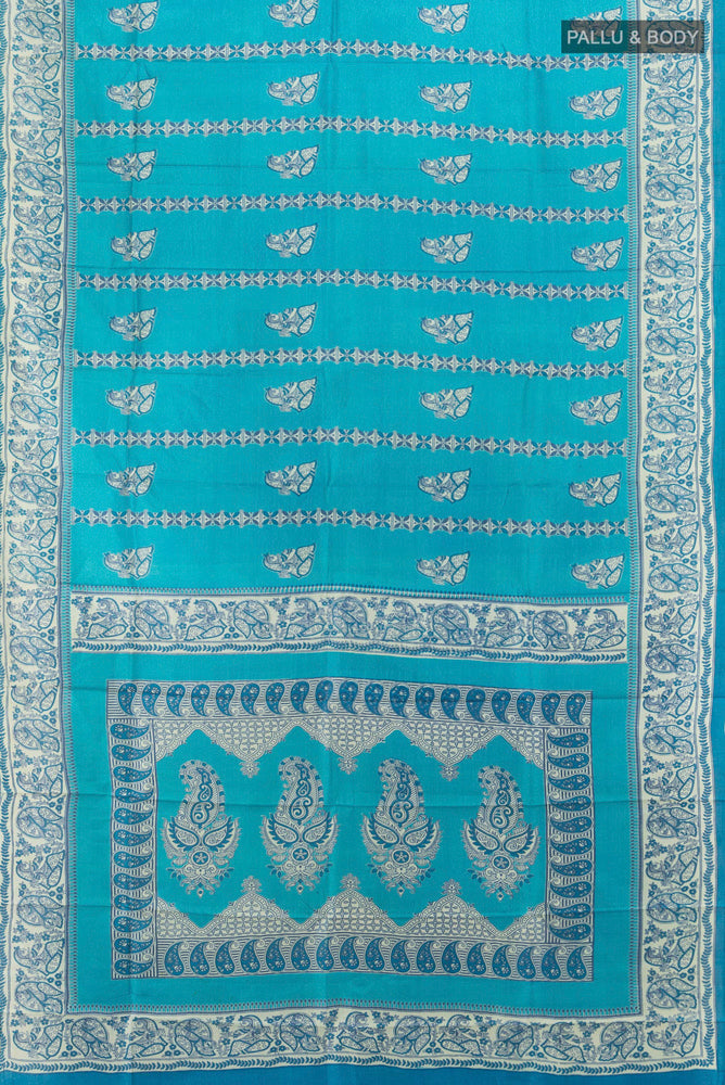 Flat view of Light Blue Tussar Silk Saree with Floral Print on the body and Silk Border. 