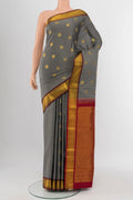 Davys Grey Kanchipuram Silk Saree with Zari Butta on the body and Silk Border.  displayed on a mannequin
