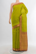 Light Green Kanchipuram Silk Saree with Zari Butta on the body and Zari Border.  displayed on a mannequin