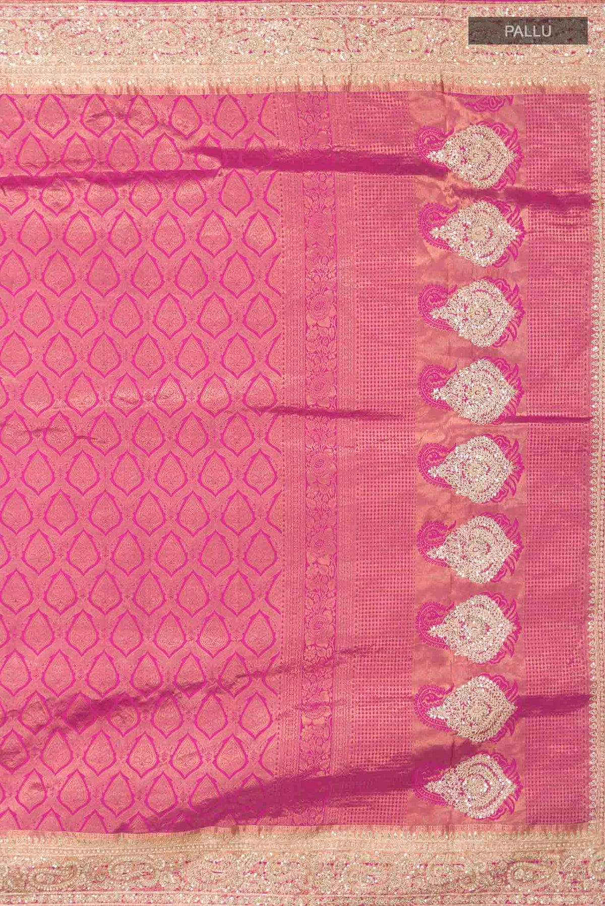 Close up image of the pallu of Pink Kanchipuram Silk Saree with Zari Brocade on the body and Embroidery Border