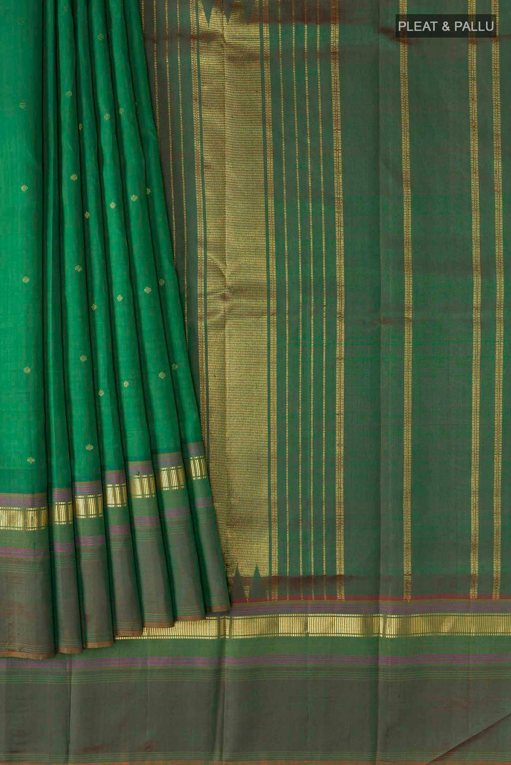 Pleats and pallu of Green Kanchipuram Silk Saree with Zari Butta on the body and Zari Border