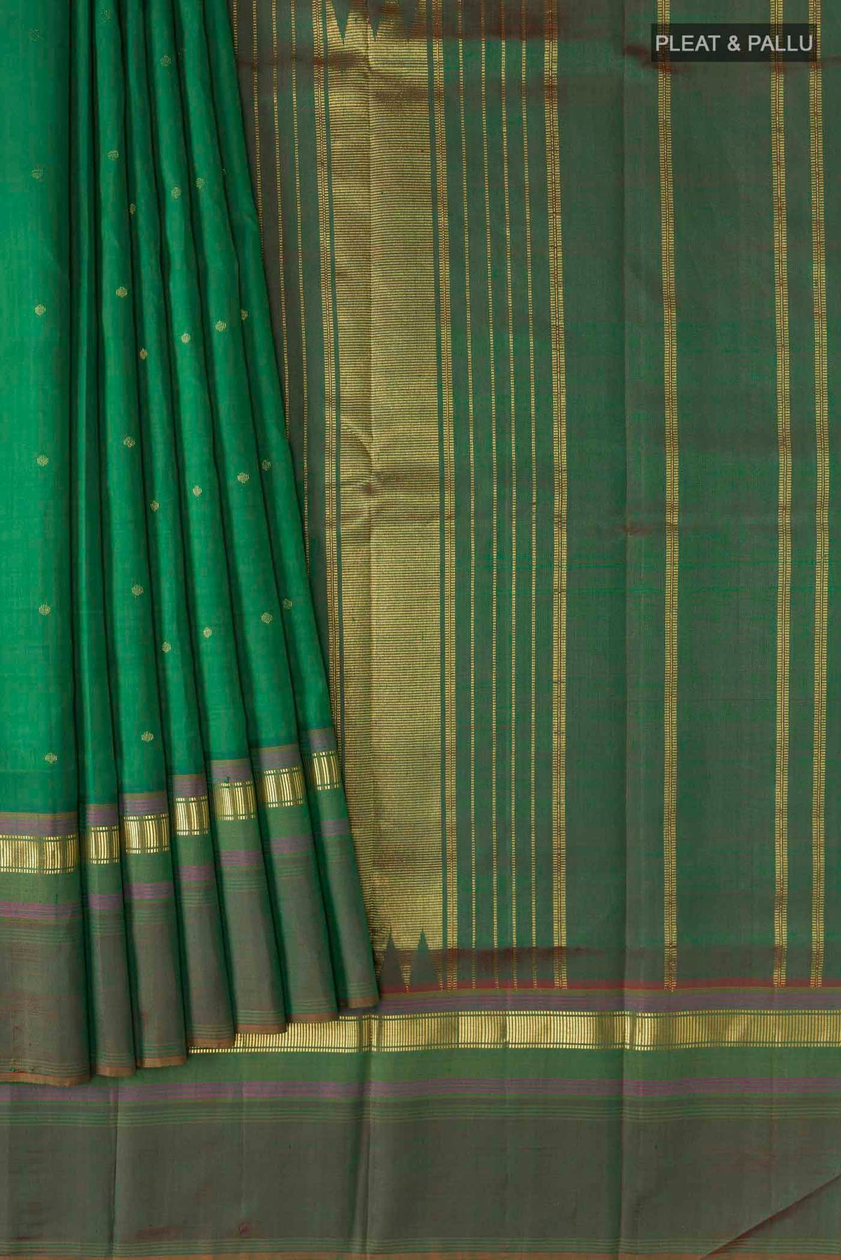 Pleats and pallu of Green Kanchipuram Silk Saree with Zari Butta on the body and Zari Border