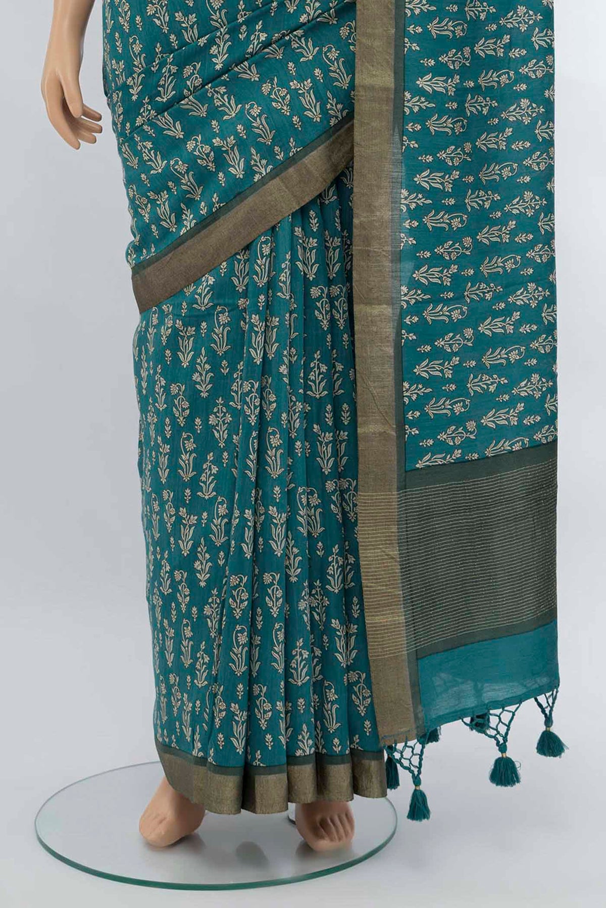 Pleats and pallu of Blue Tussar Saree with Printed design on the body and Fancy Border