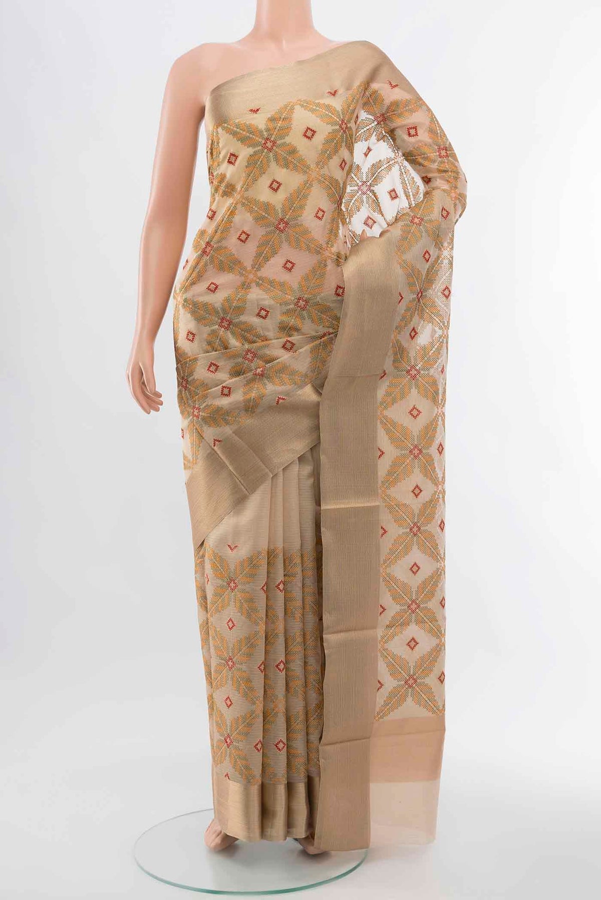 Beige Art Silk Saree with Embroidery on the body and Silk Border displayed on a mannequin