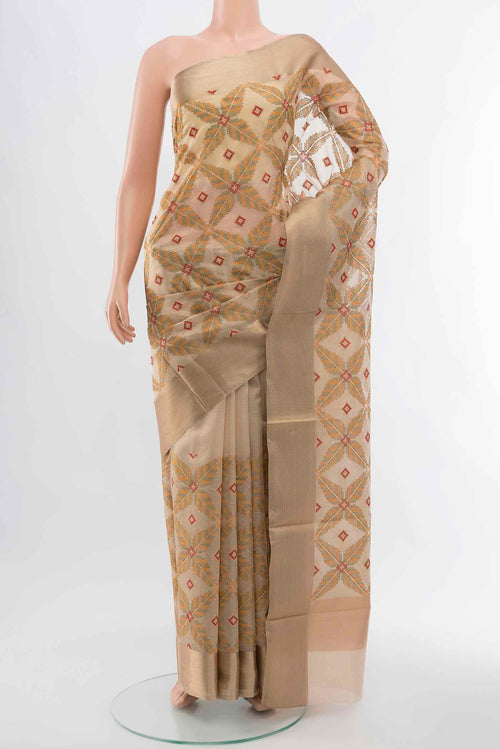 Beige Art Silk Saree with Embroidery on the body and Silk Border displayed on a mannequin