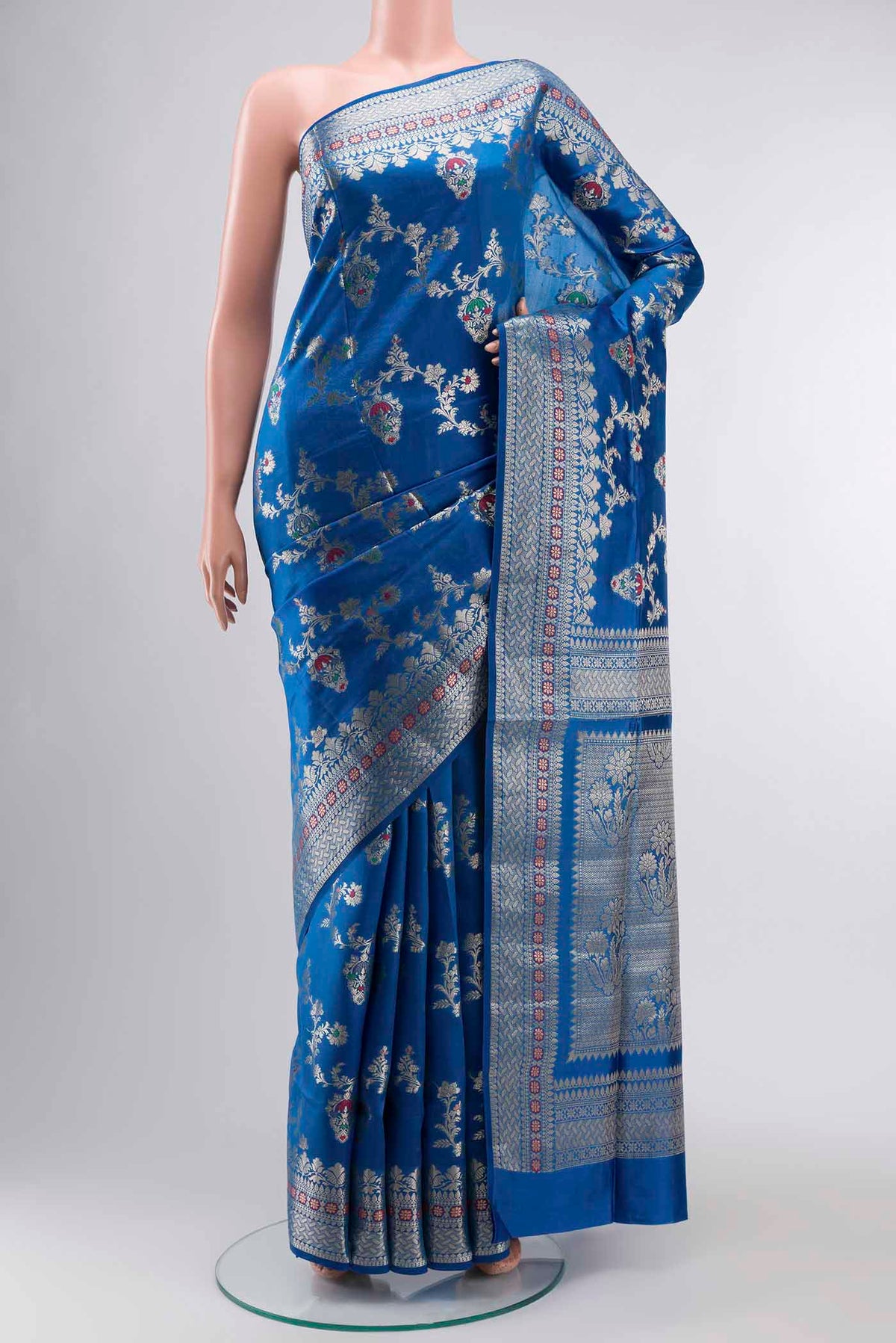Blue Banarasi Raw Silk Saree with Zari Butta on the body and Zari Border displayed on a mannequin