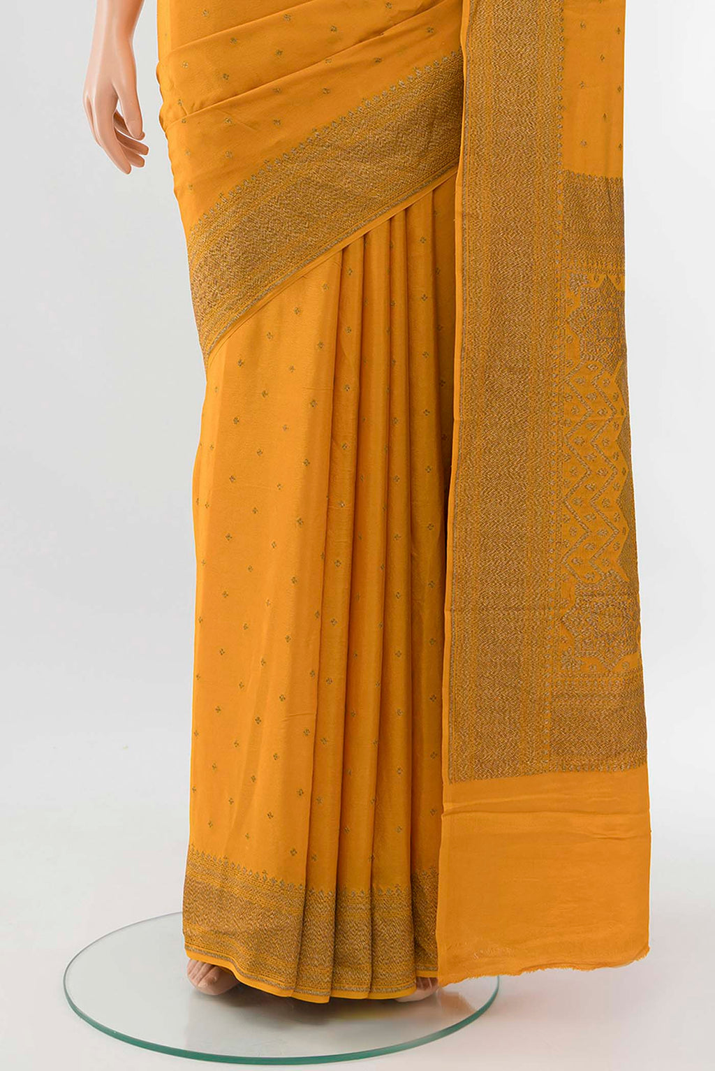 Pleats and pallu of Orange Mysore Crepe Saree with Zari Butta on the body and Zari Border