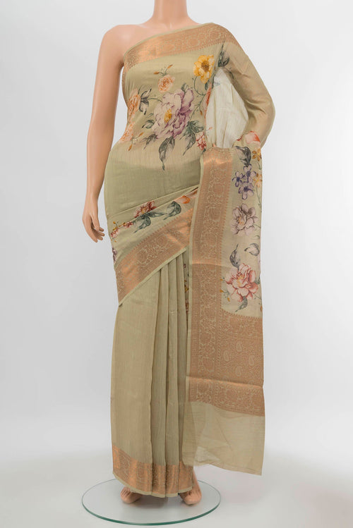Green Bhagalpuri Tussar Silk Saree with Printed design on the body and Zari Border displayed on a mannequin