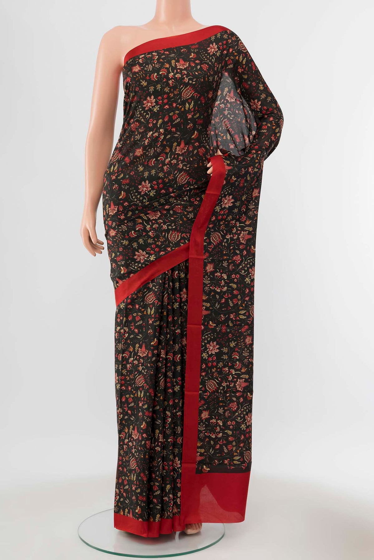 Black Printed Silk Saree with Thread Butta on the body and Silk Border displayed on a mannequin