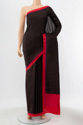 Black Printed Silk Saree with Printed design on the body and Silk Border displayed on a mannequin