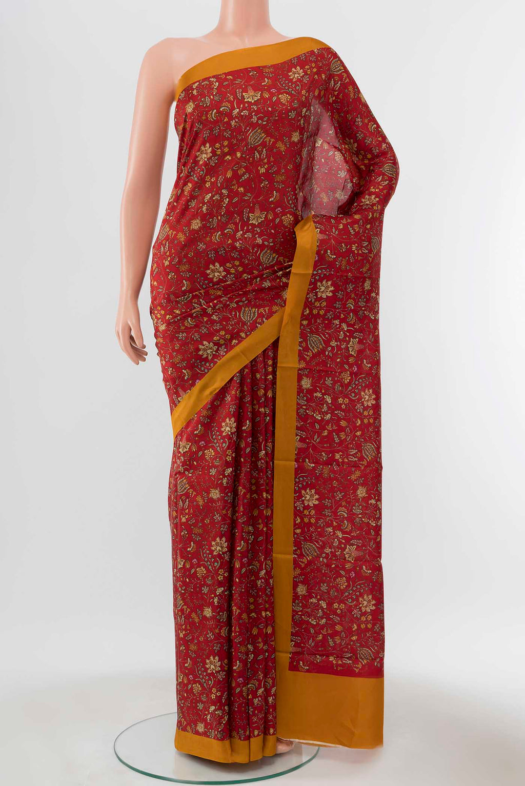 Maroon Printed Silk Saree with Printed design on the body and Plain Border displayed on a mannequin
