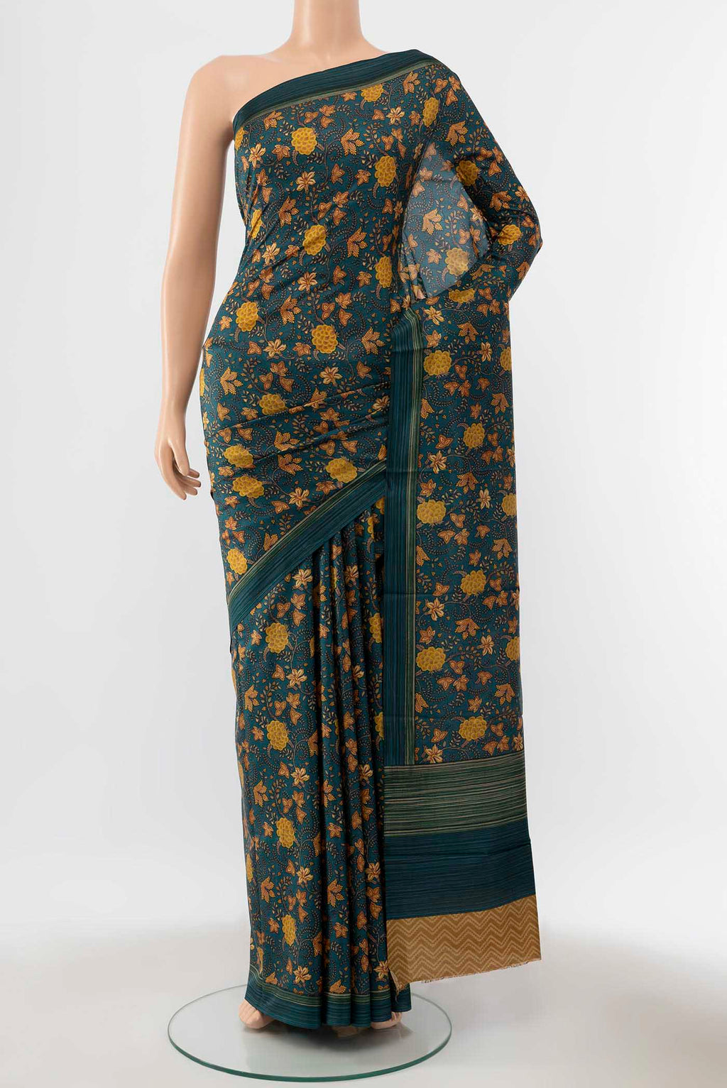Peacock Blue Printed Silk Saree with Floral Print on the body and Silk Border displayed on a mannequin