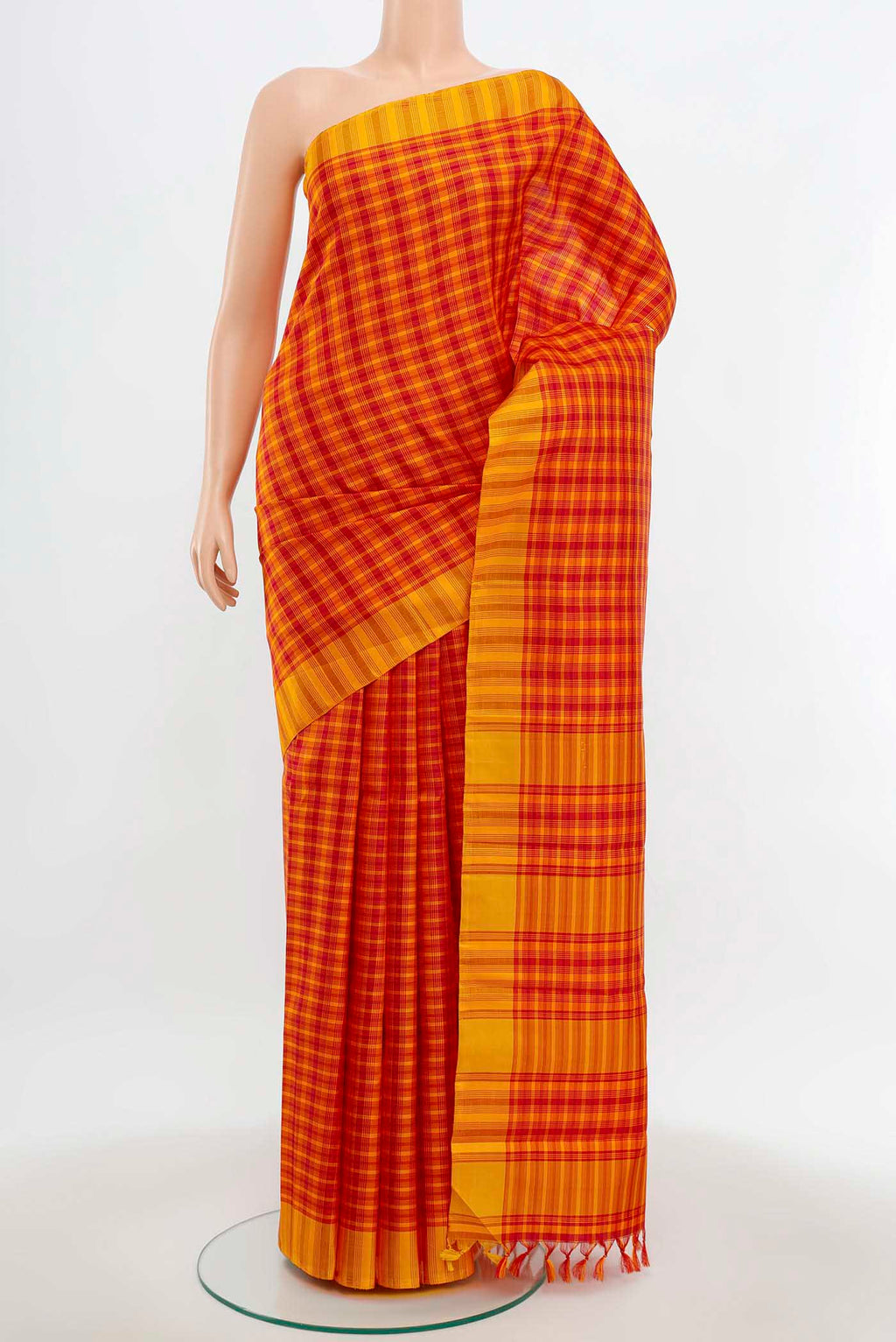Maroon Kanchipuram Silk Saree with Zari Butta on the body and Silk Border.  displayed on a mannequin