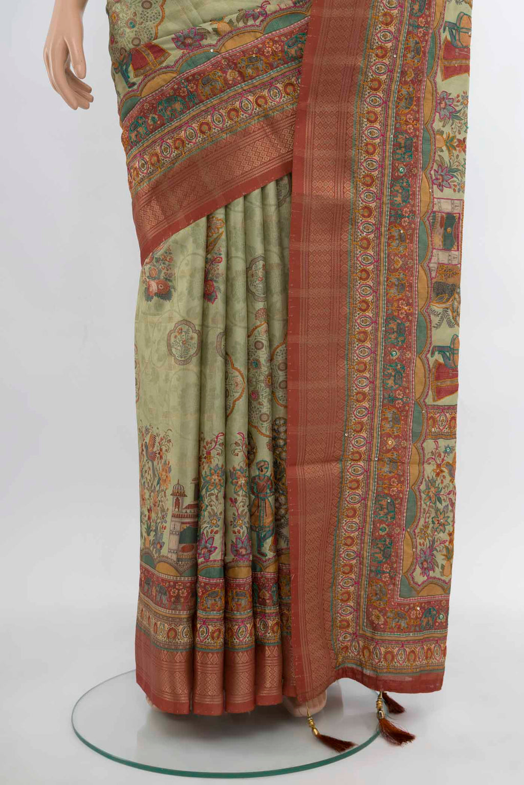 Pleats and pallu of Pista Green Art Silk Saree with Embroidery on the body and Silk Border. 