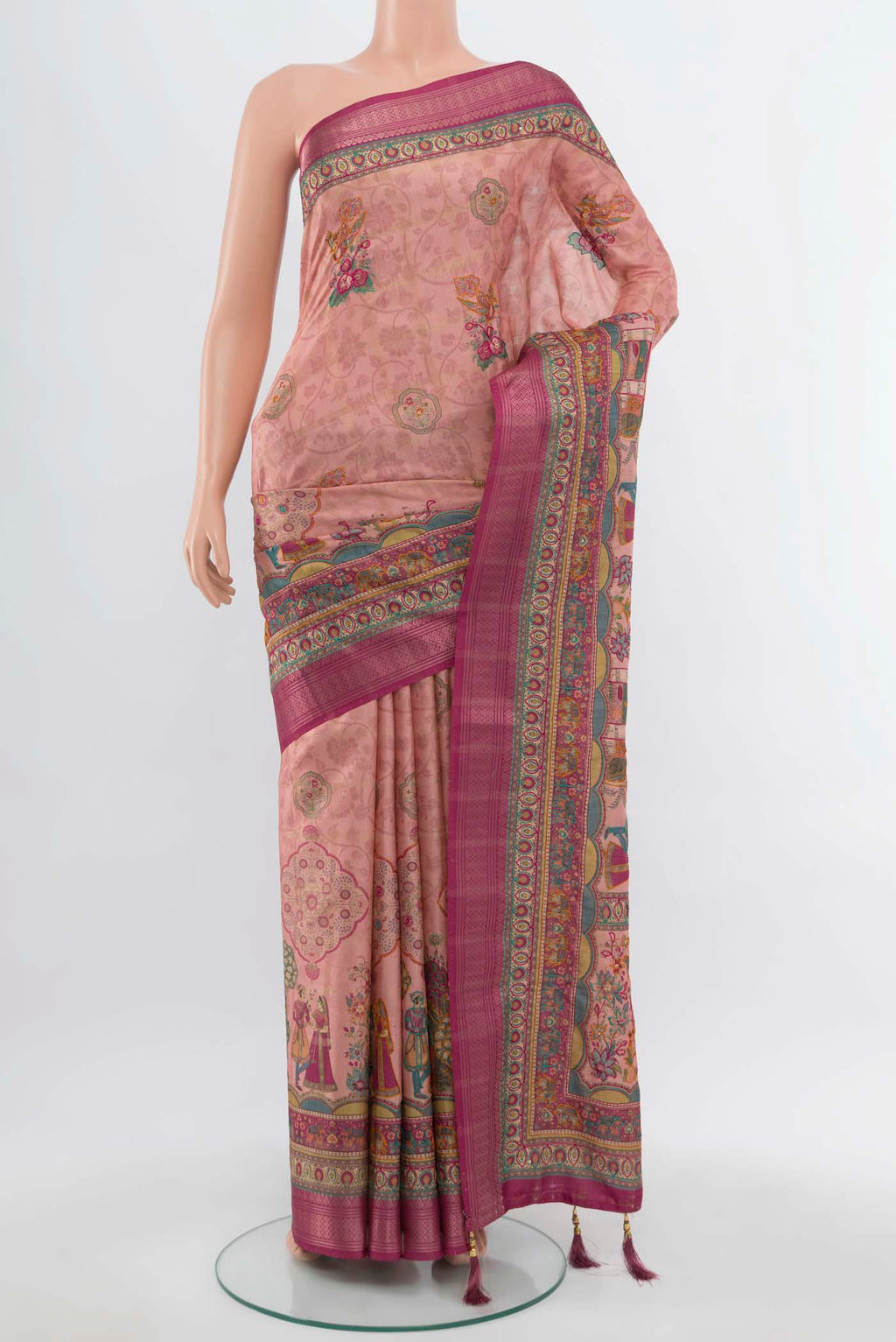 Peach Art Silk Saree with Embroidery on the body and Silk Border.  displayed on a mannequin