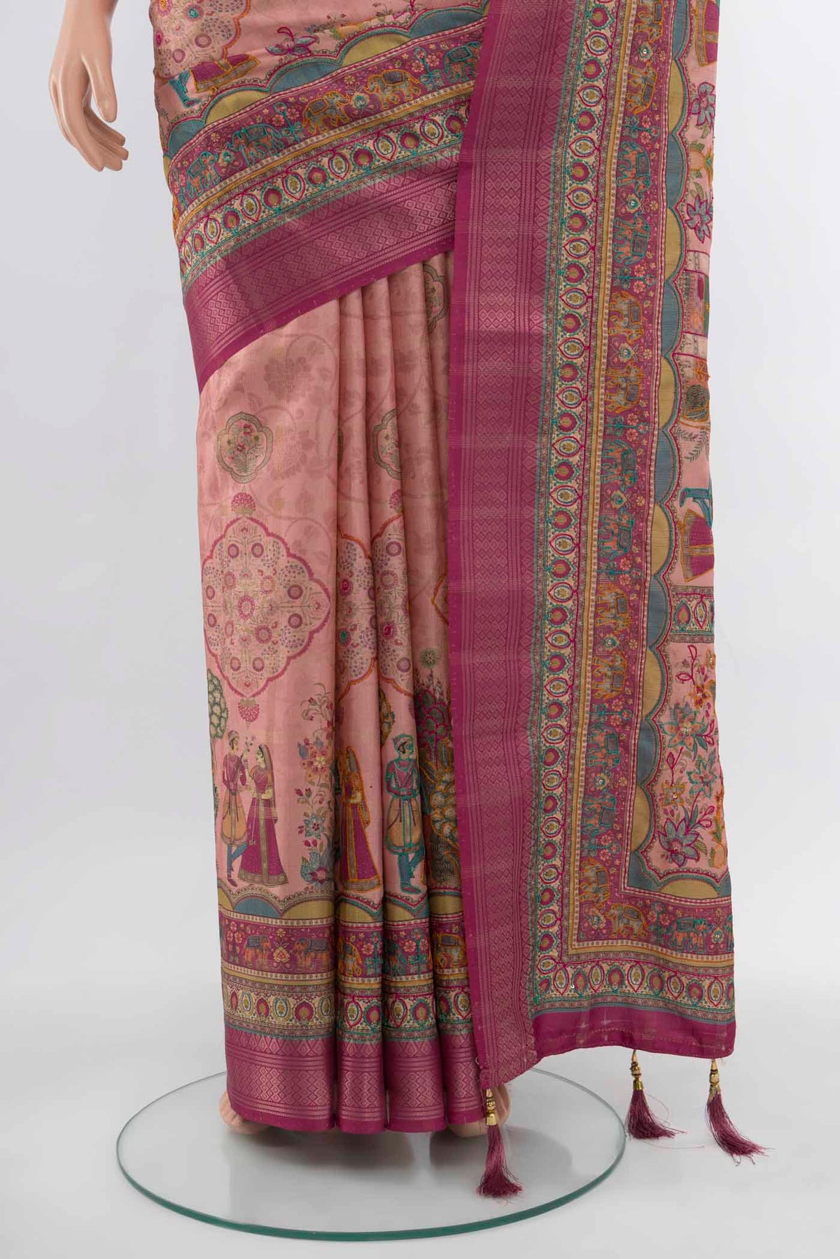 Pleats and pallu of Peach Art Silk Saree with Embroidery on the body and Silk Border. 