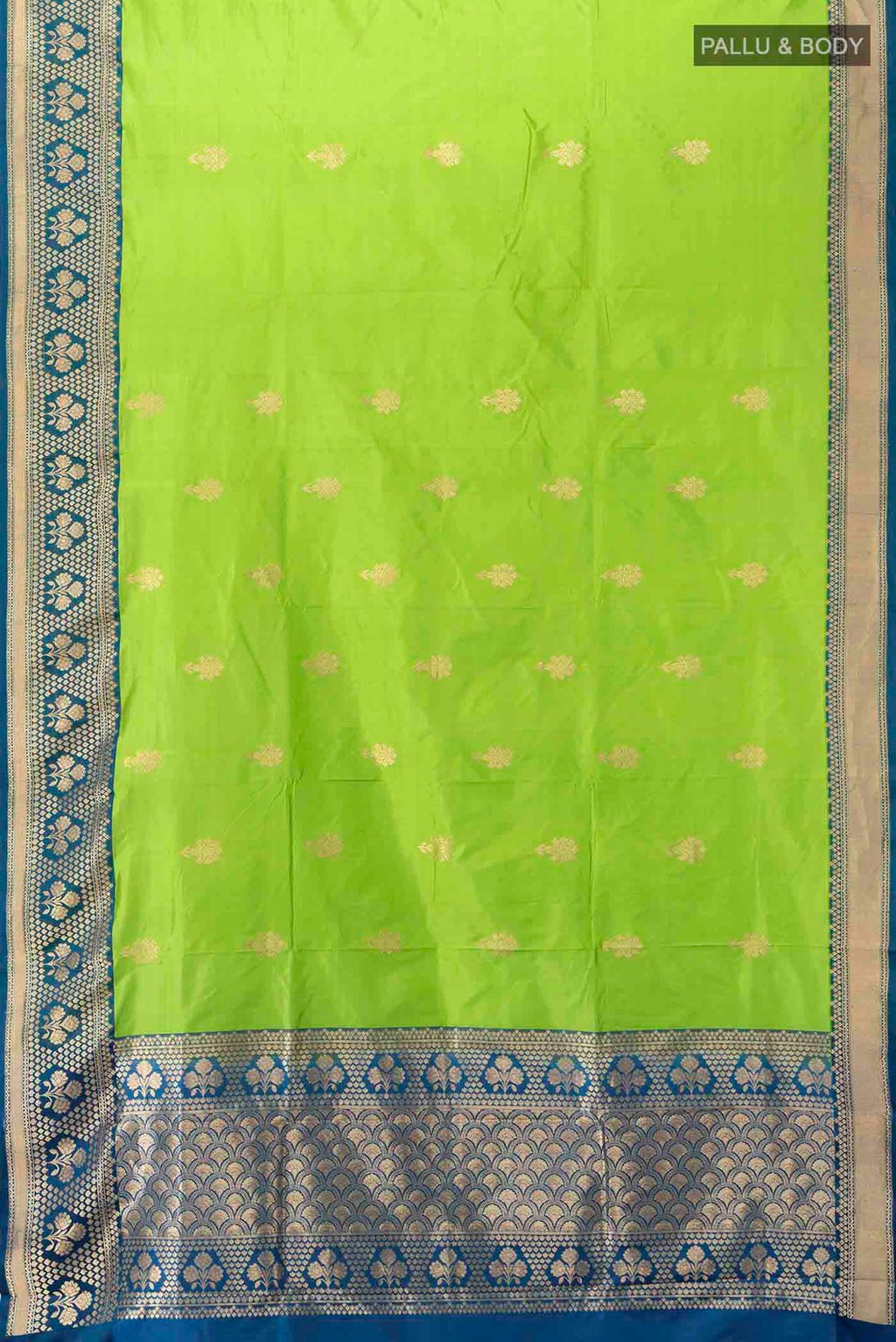 Flat view of Parrot Green Banarasi Katan Silk Saree with Zari Butta on the body and Silk Border