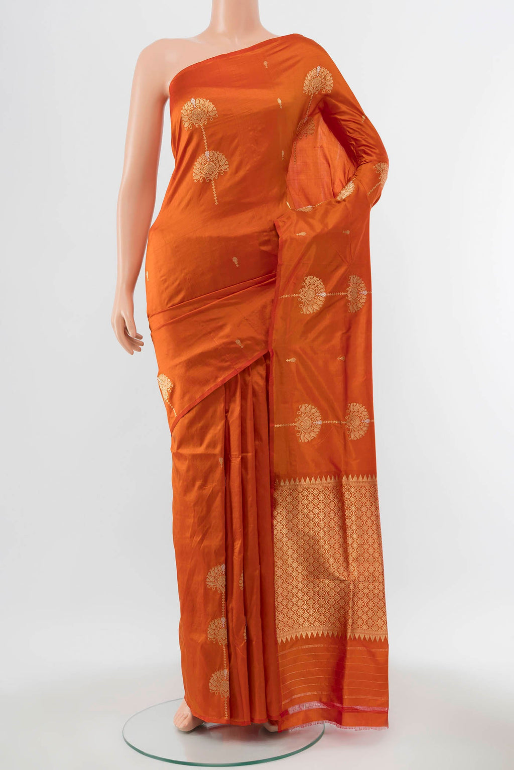 Orange Banarasi Katan Silk Saree with Zari Butta on the body and Without Border displayed on a mannequin