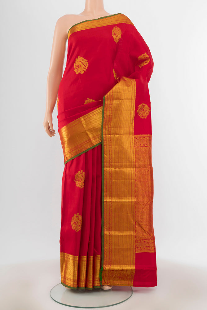 Red Kanjivaram Silk Saree with Zari Butta on the body and Zari Border.  displayed on a mannequin