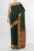 Pure Silk Pure Zari Mint Green Kanchipuram Saree with Zari Butta on the body and Silk Border.  displayed on a mannequin